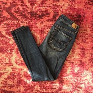 Distressed medium wash AE jegging